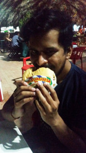 Manish enjoying burger